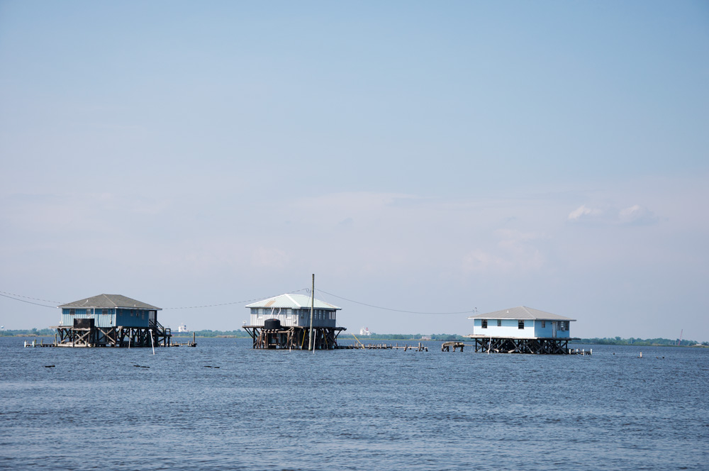 Coastal Louisiana scene: fishing camps built over the water