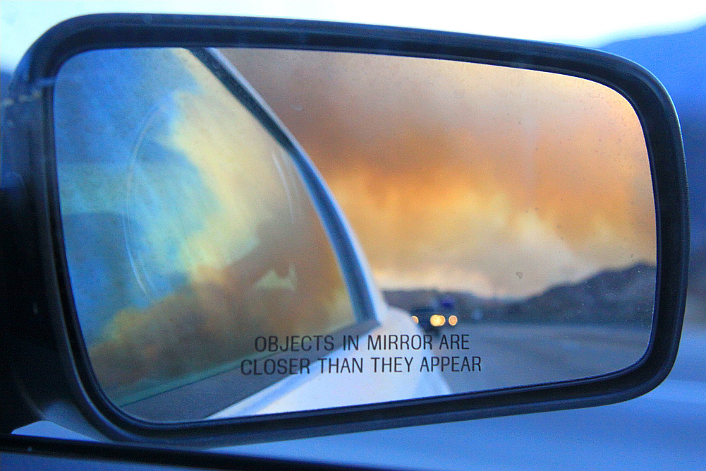Wildfire in car mirror